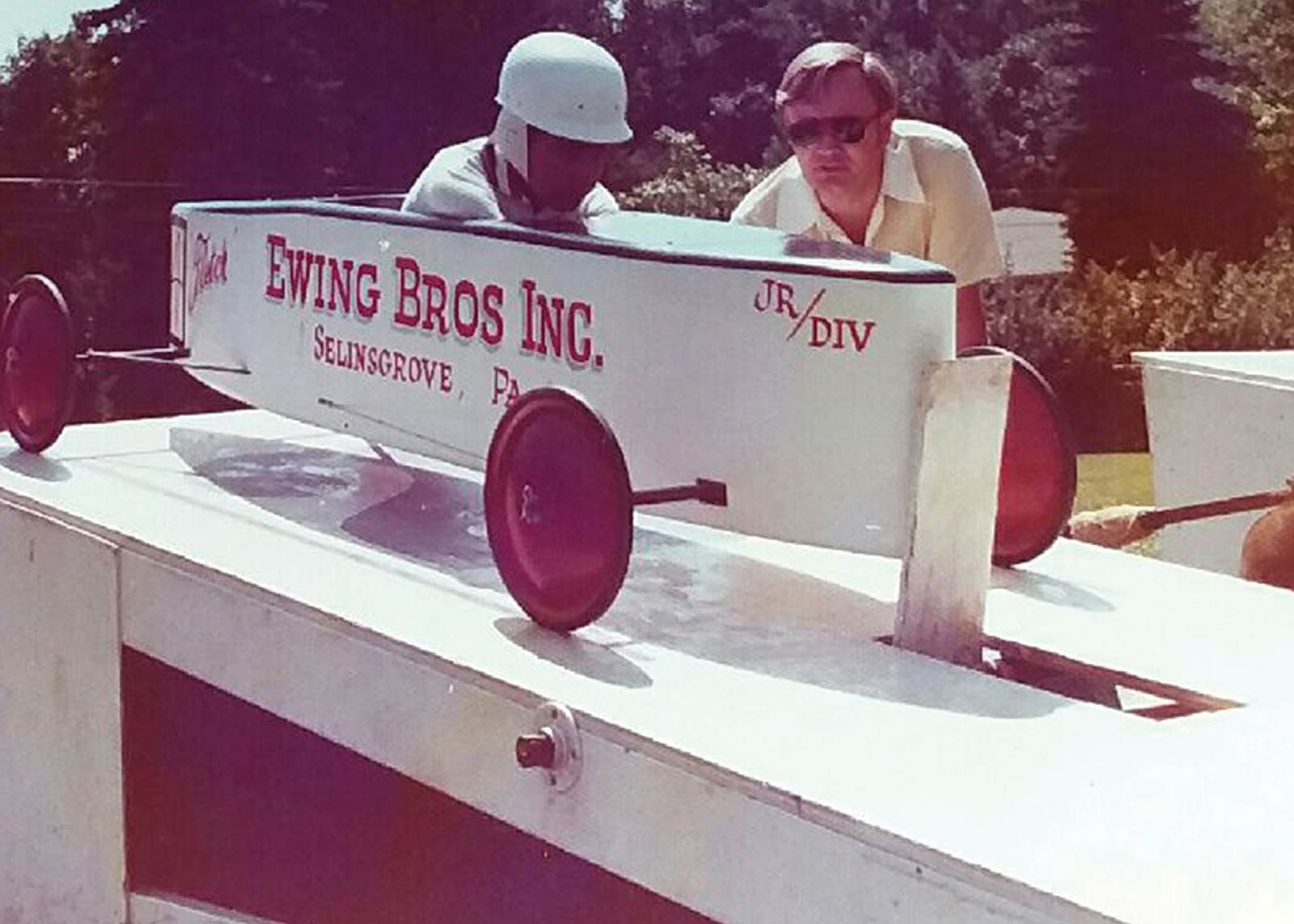 Ewing patiently waits for the start of a Soap Box Derby race at Bucknell University in the mid-1970s. At right is Ewing’s father, Dalas, who with his two brothers owned Ewing Brothers Inc., a custom home builders business. Ewing’s dad eventually branched off to form his own company: Ewing Building Products.