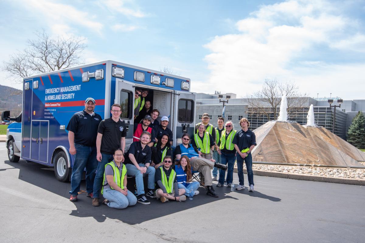 Schlosser (far left) and his emergency management & homeland security students pose for a celebratory image at the end of a successful undertaking. 