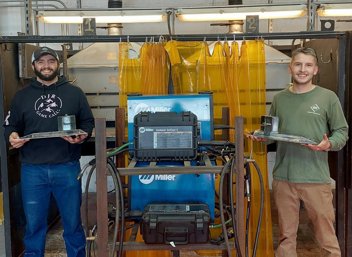 Patrick C. Evanko (left), of Columbus, N.J., placed first, and Nikolas J. Harnish, of Newmanstown, earned second-place honors in the Project MFG Maritime Welding Competition held Wednesday at the Philadelphia Shipyard.