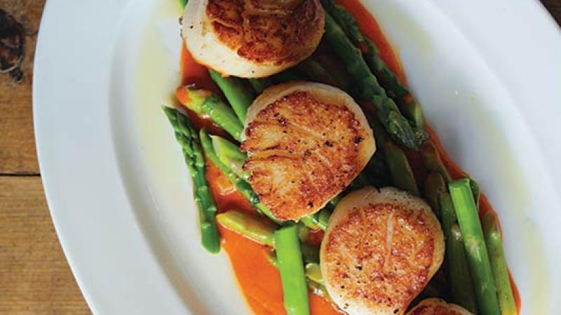  Among her spring dinner menu dishes are seared sea scallops with asparagus, preserved lemon and roasted red pepper. Photo courtesy of Amis Trattoria