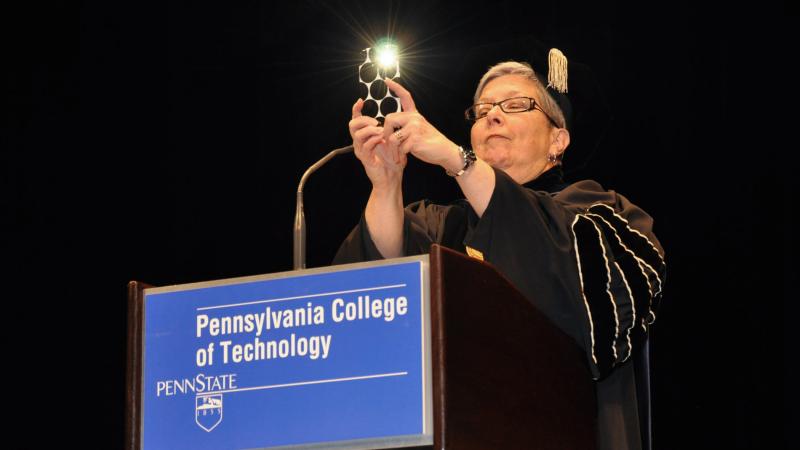 Gilmour takes the first photo of the ceremony during commencement, encouraging audience members to capture their own memories.